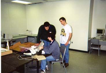 Mike, Nate, and Kevin admire the	switch.